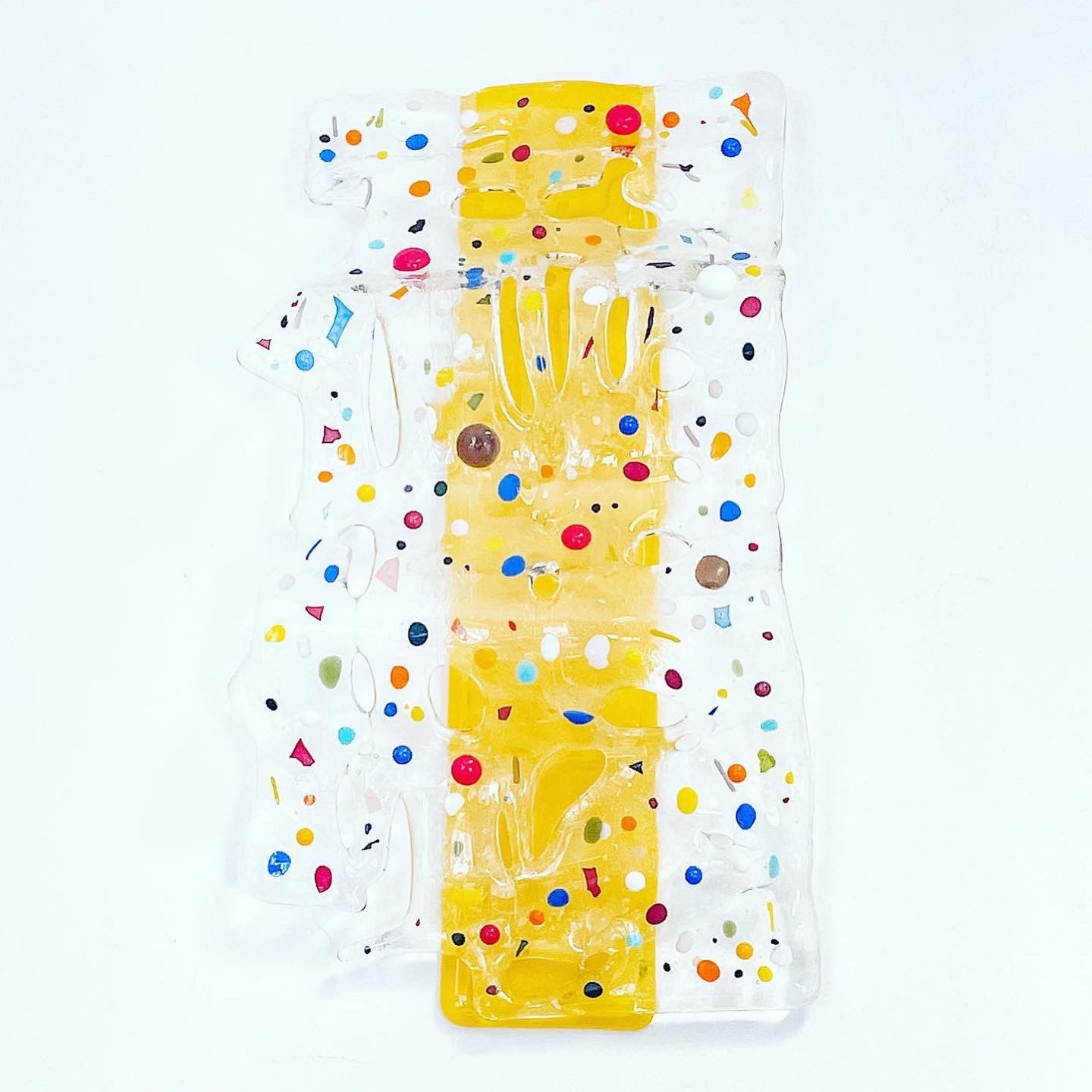 Yellow glass wave sculpture