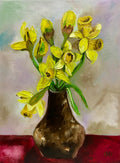 Daffodils on red table, spring in London.