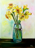 Bouquet of daffodils #3 in a glass on the wooden table.