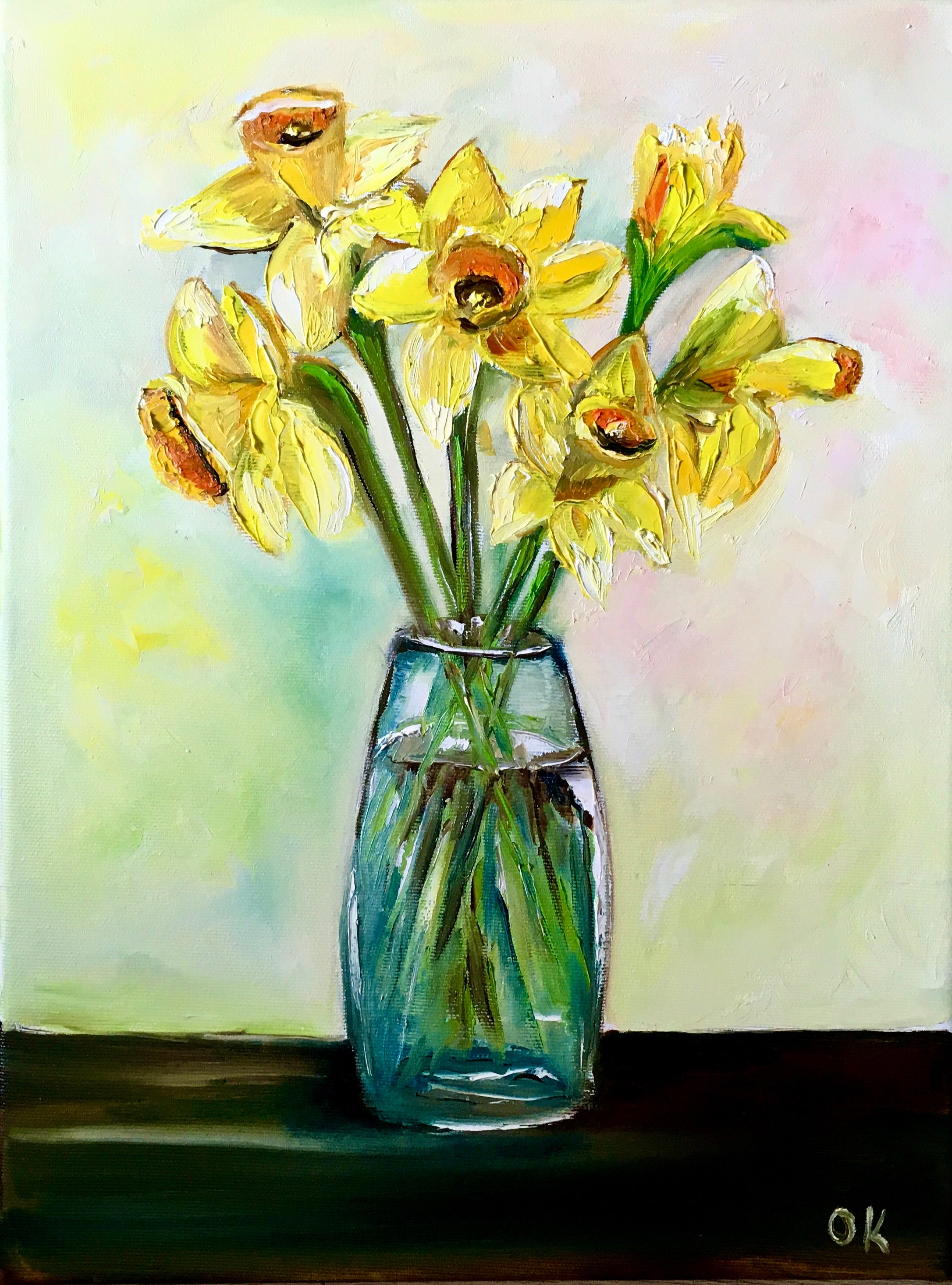 Bouquet of daffodils #3 in a glass on the wooden table.