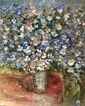 Bouquet of white and blue flowers in a vase