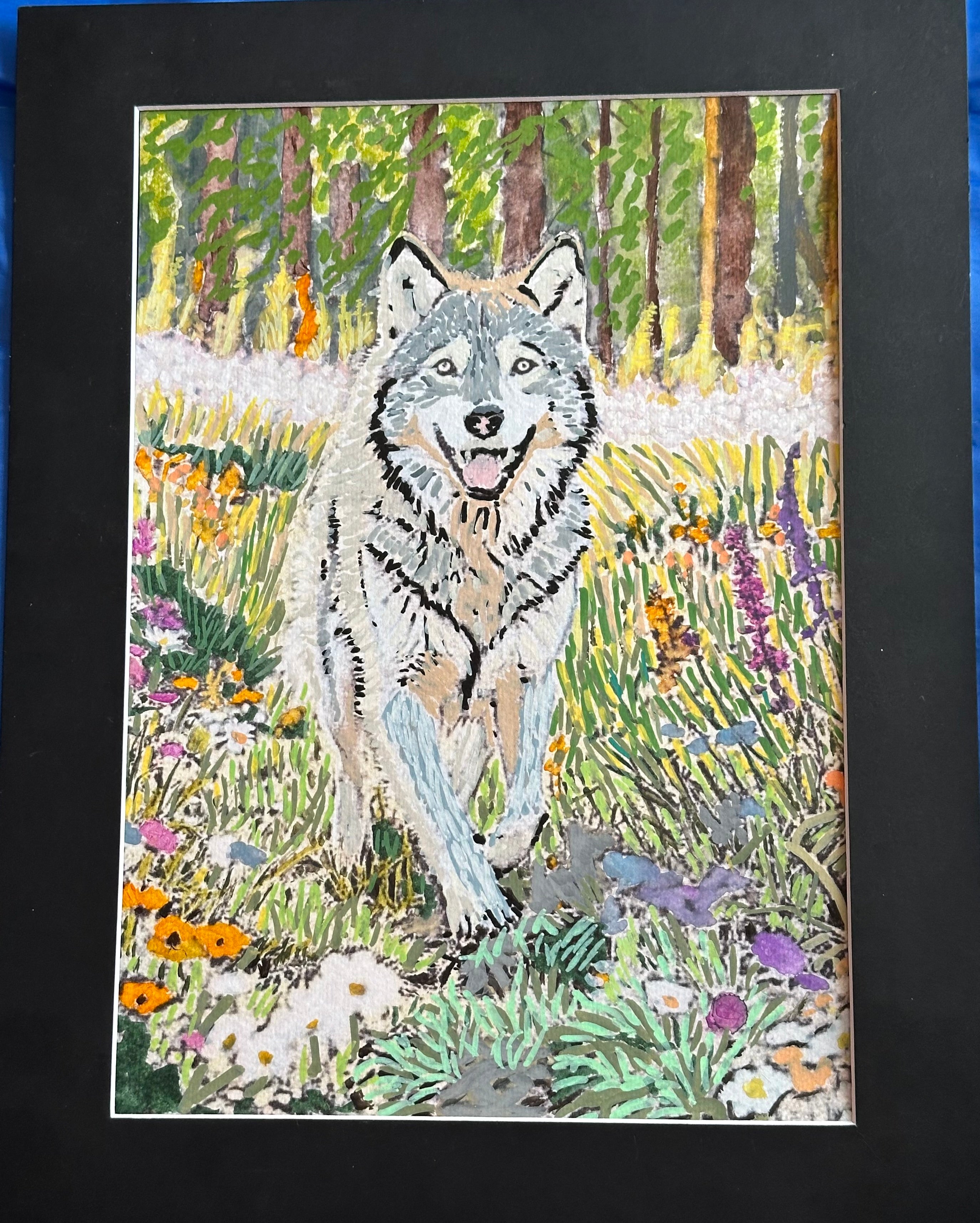 Wolf enjoying spring sunshine and flowers