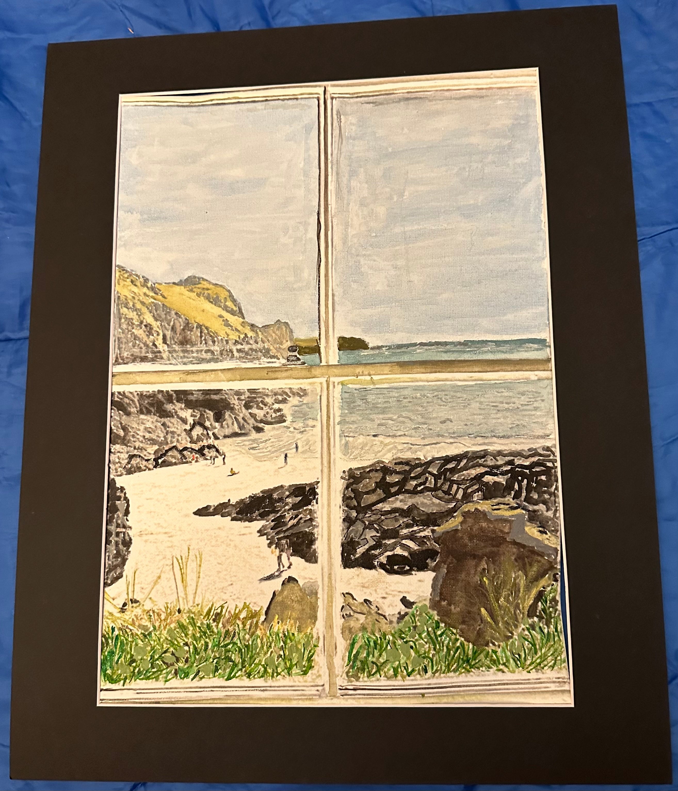 Veiw through a window of a coastal path