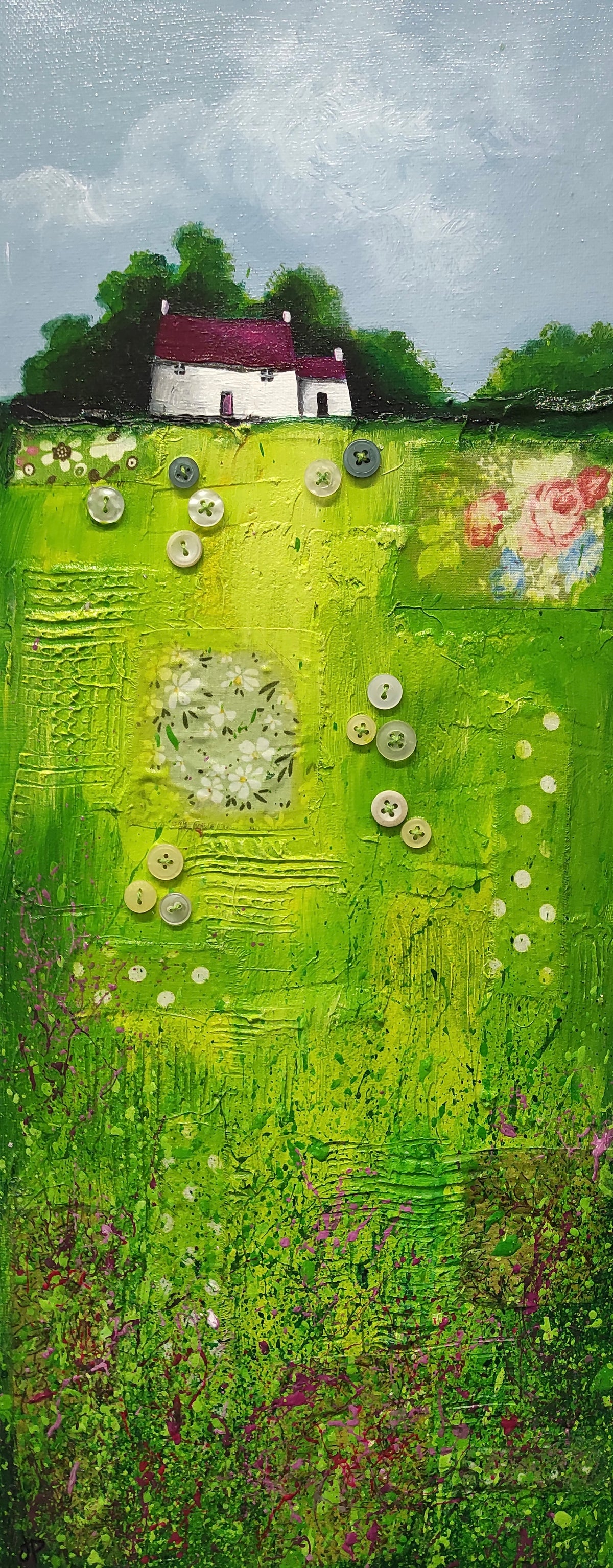 House on green patchwork field