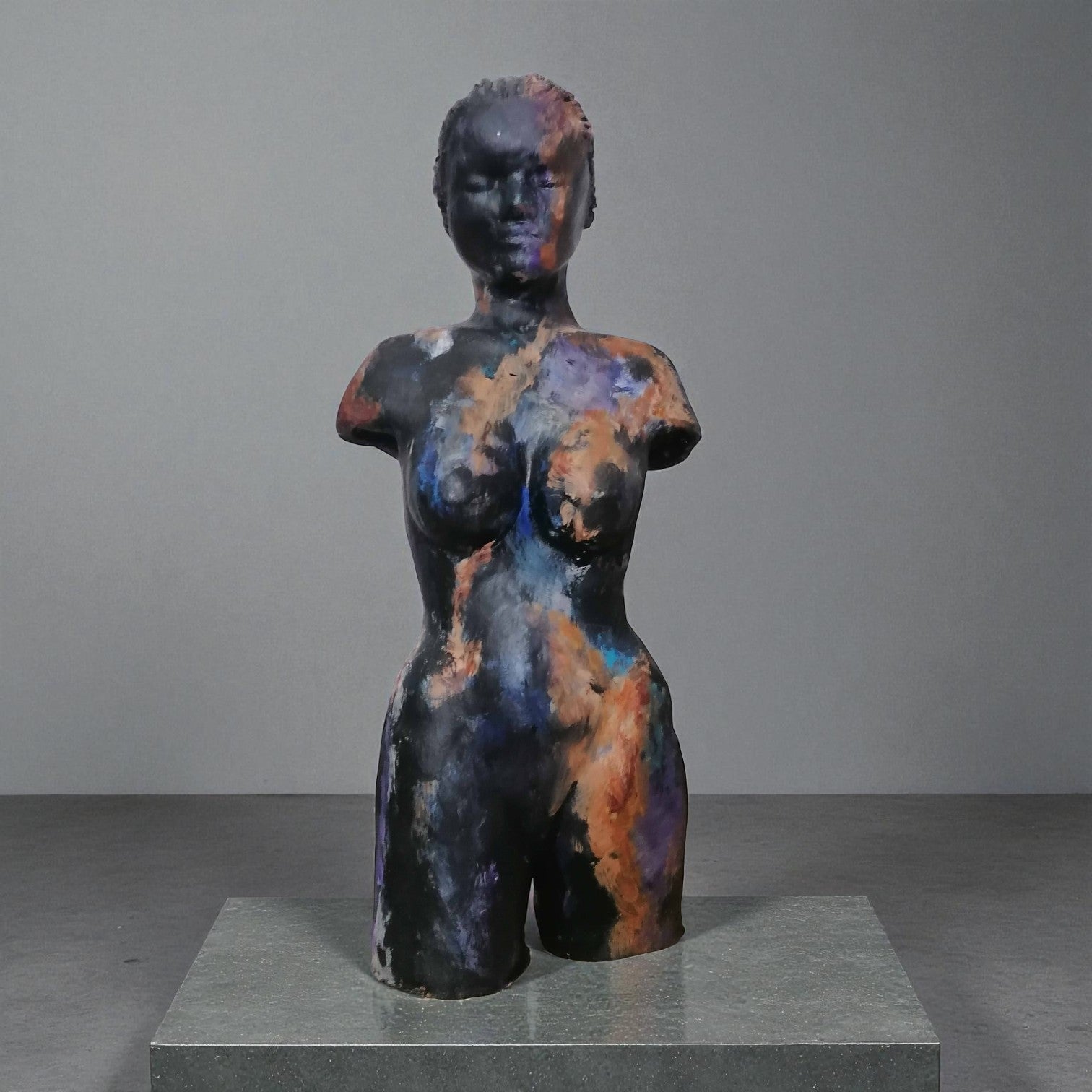 Woman, sculpture made in clay and painted with an abstract pattern