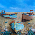 Three boats on the beach